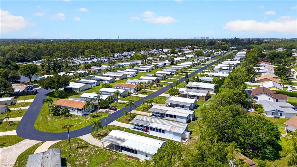 Community featuring paved roadways and mature landscaping