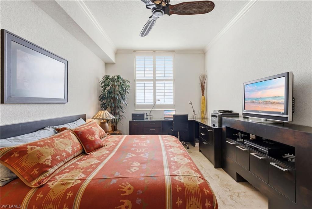 The second bedroom is thoughtfully designed to serve as a stylish home office, where abundant natural light pours in, creating a bright and inspiring workspace.