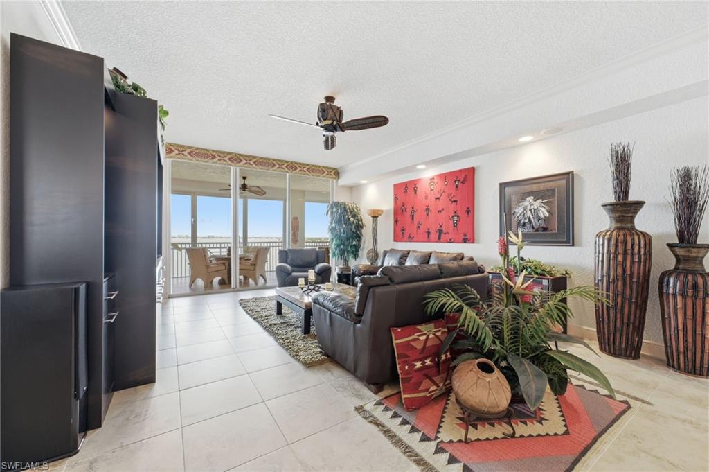 Enjoy breathtaking, unobstructed views every day, creating a spectacular backdrop from sunrise to sunset. Inside, elegant tile flooring flows seamlessly throughout the residence, complemented by refined crown molding and a spacious open-concept great room designed for both luxurious living and effortless entertaining.