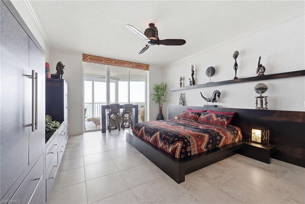 The expansive primary suite offers a spacious and serene retreat, featuring generous proportions, private access to the lanai, and a luxurious ensuite bath designed for comfort and relaxation.
