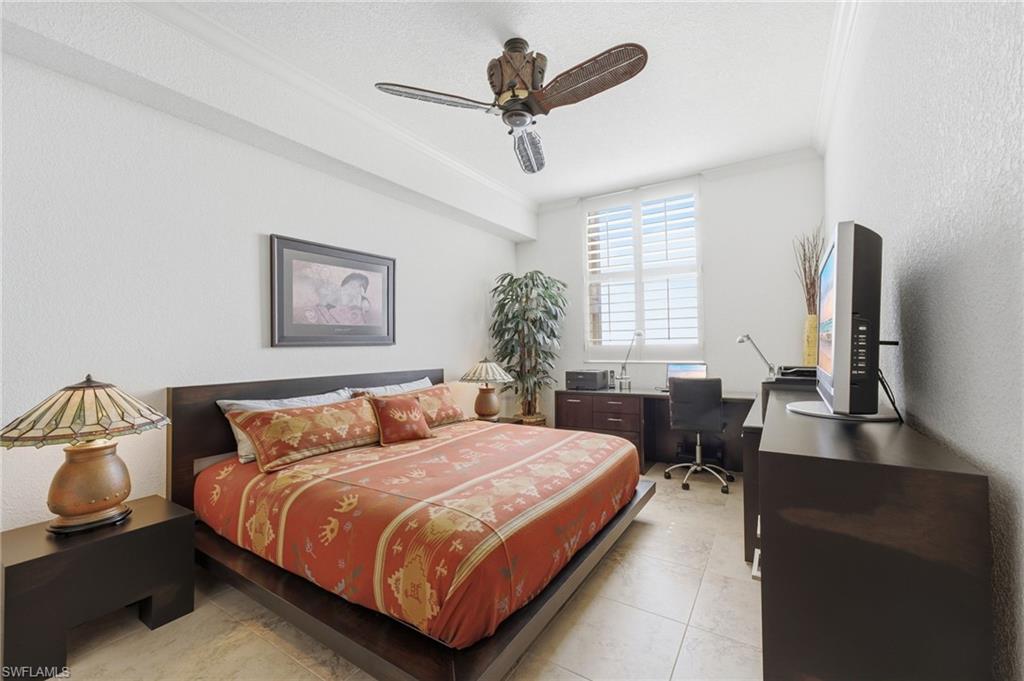 The spacious second bedroom offers a comfortable and inviting retreat, beautifully enhanced with elegant plantation shutters that provide timeless style, privacy, and natural light control.