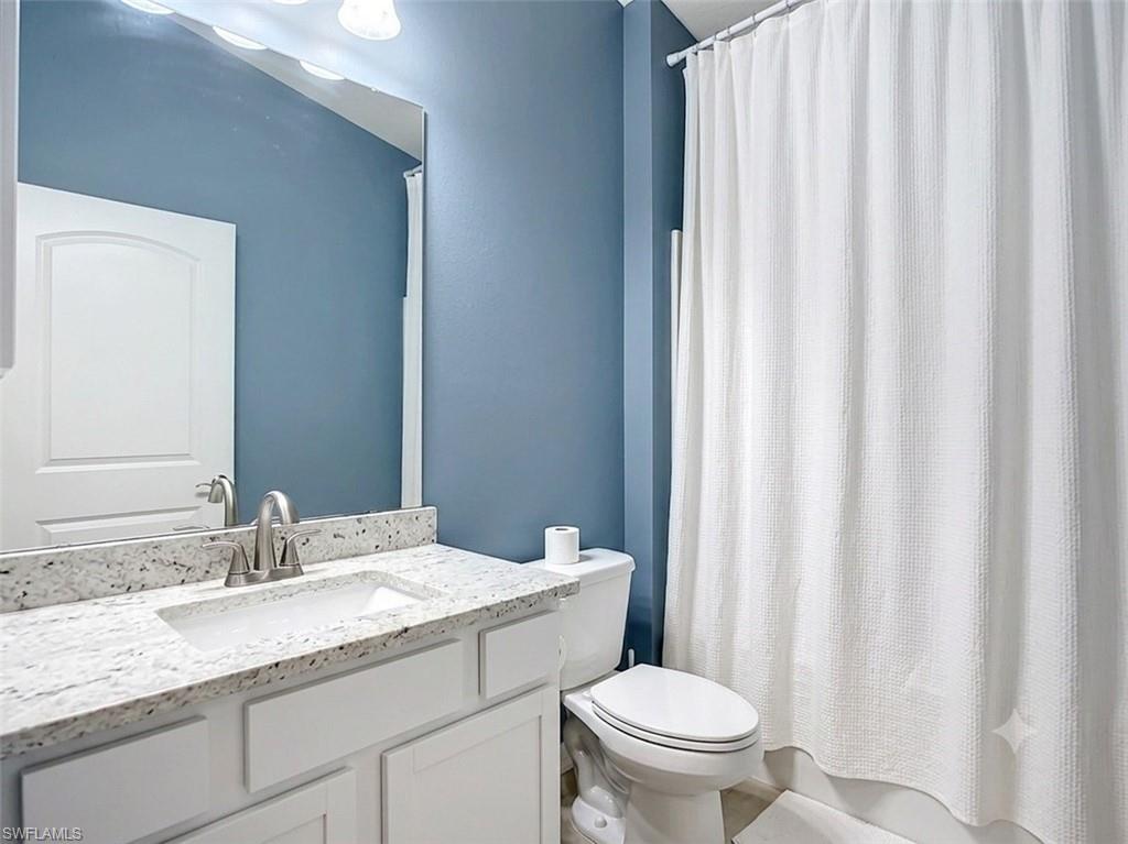 VIRTUALLY STAGED - Guest bathroom.
