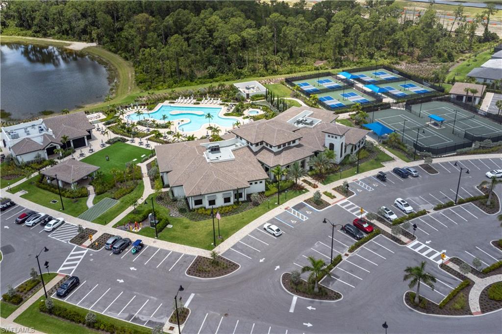 aerial view of clubhouse, pavilion bar and restaurant, pool and pickleball and tennis courts