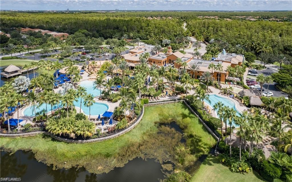 Aerial view of property and surrounding area with a pool area
