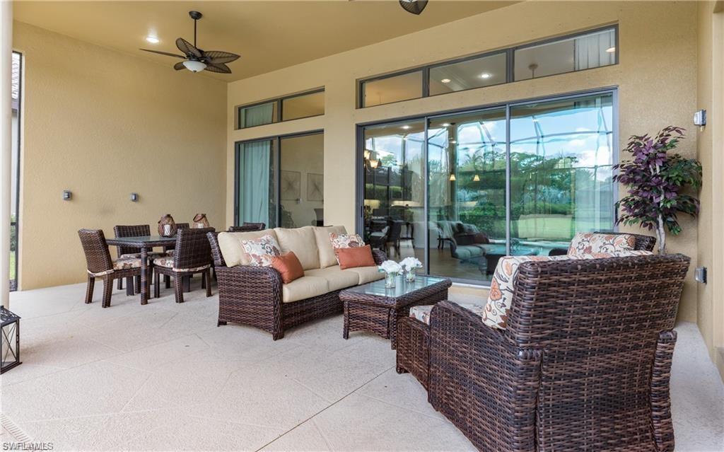 View of patio featuring an outdoor hangout area, ceiling fan, and outdoor dining space