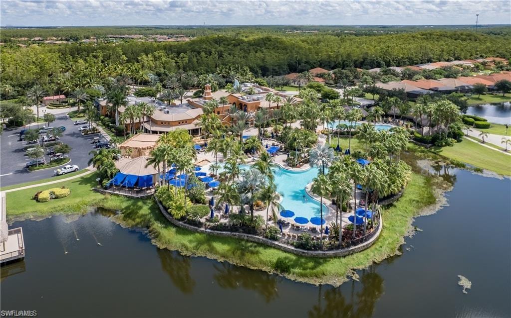 Drone / aerial view of a pool and a large body of water