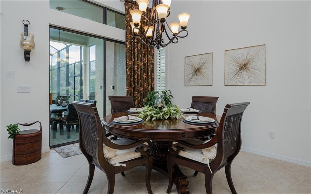 Dining space with a chandelier and light tile patterned floors