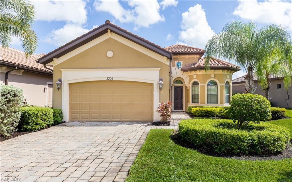 Mediterranean / spanish home with stucco siding, decorative driveway, a garage, and a tiled roof