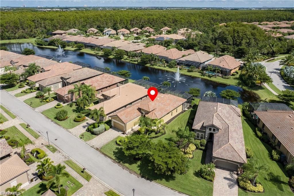 Aerial perspective of suburban area featuring a large body of water