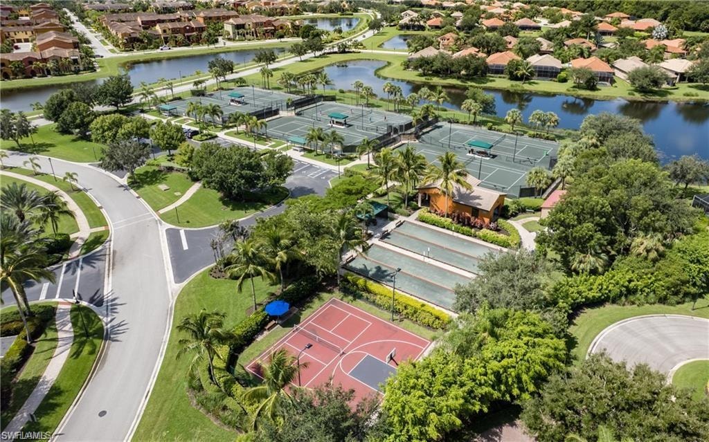 Aerial perspective of suburban area featuring a large body of water