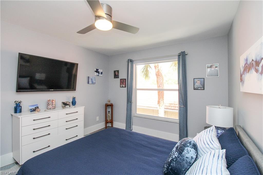 Bedroom with carpet and ceiling fan