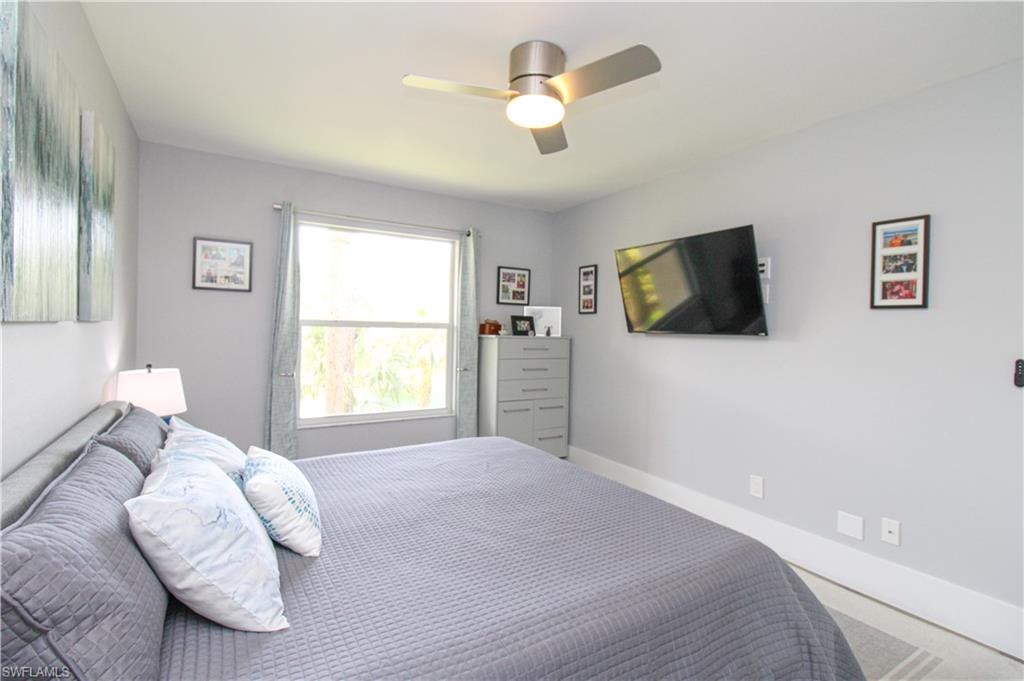 Bedroom featuring carpet and ceiling fan