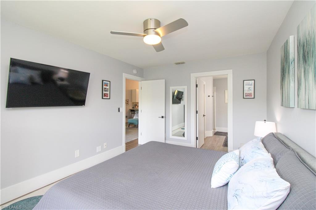 Bedroom featuring ceiling fan and hardwood / wood-style flooring
