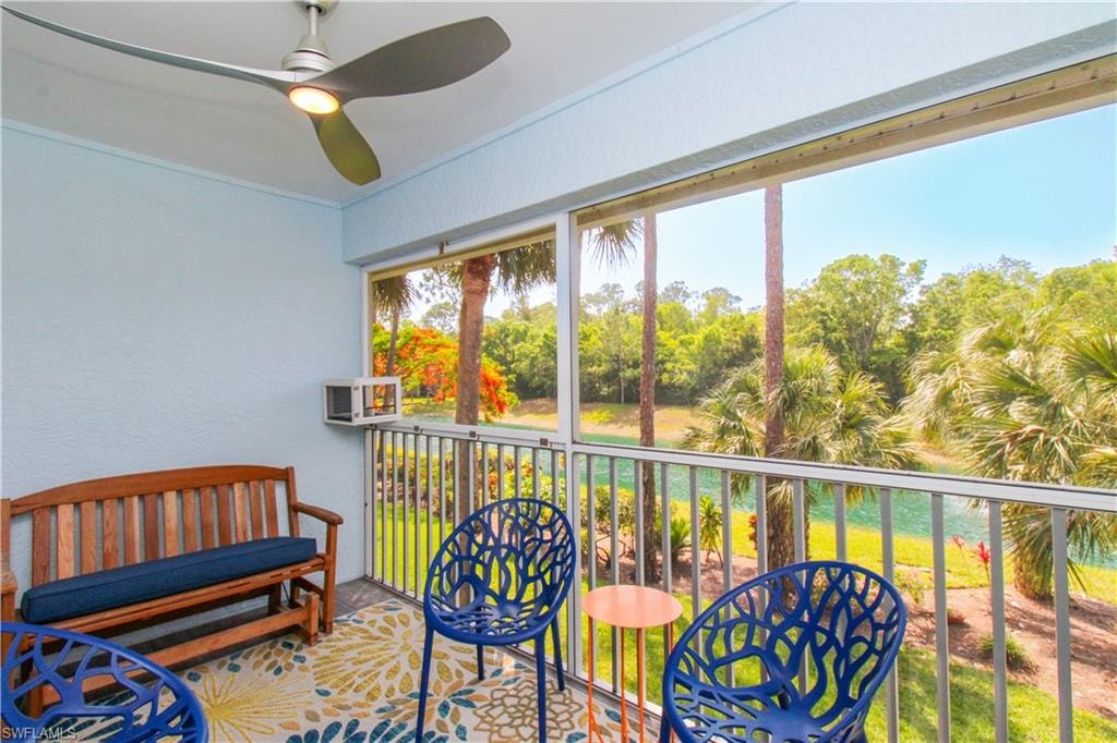 Sunroom featuring ceiling fan