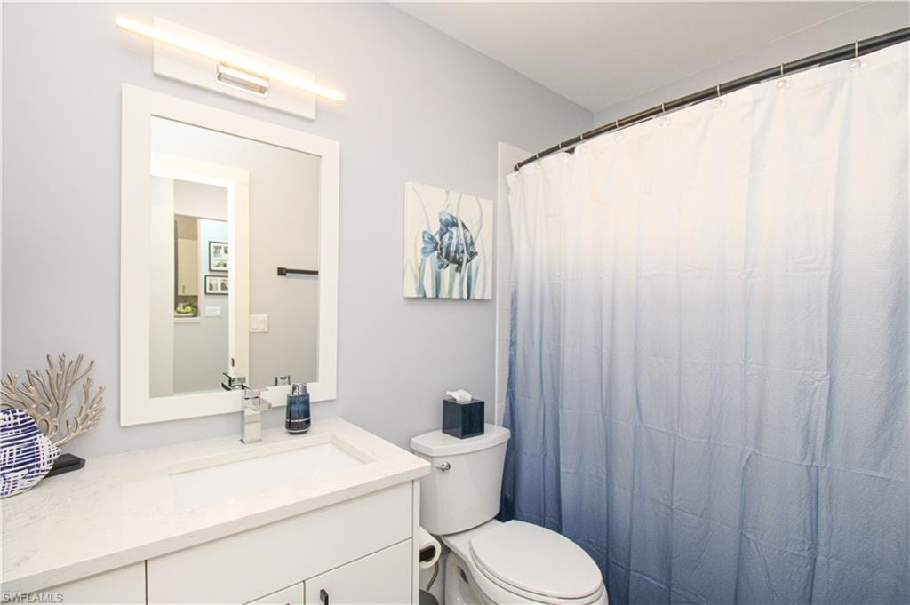 Bathroom with vanity and toilet
