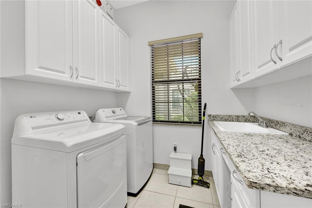Large Laundry room with plenty of storage (lower cabinet door will be put back on)