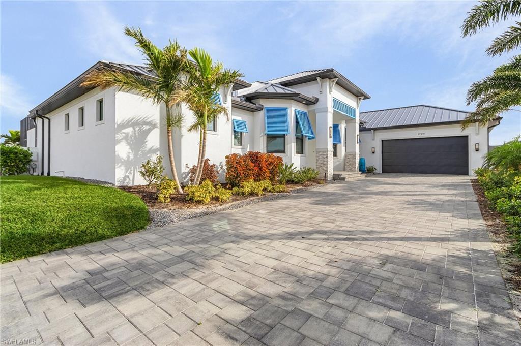 View of front of property featuring a garage