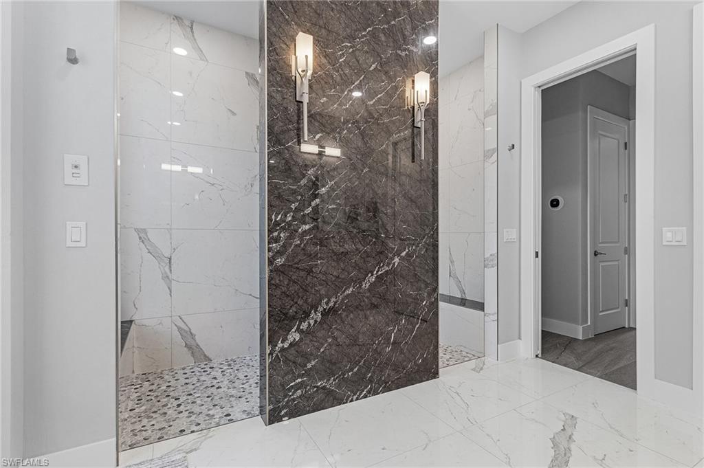 Bathroom featuring tiled shower