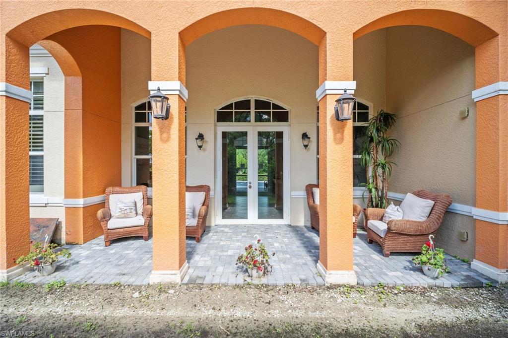 Entrance to property with french doors and stucco siding
