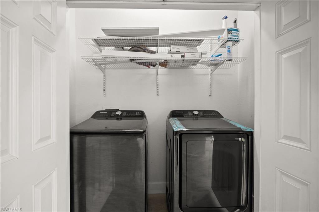 Washroom featuring independent washer and dryer