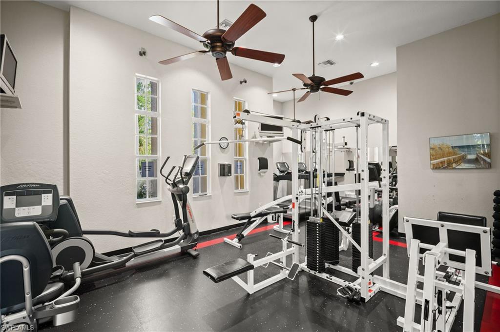 Exercise area featuring a ceiling fan and recessed lighting