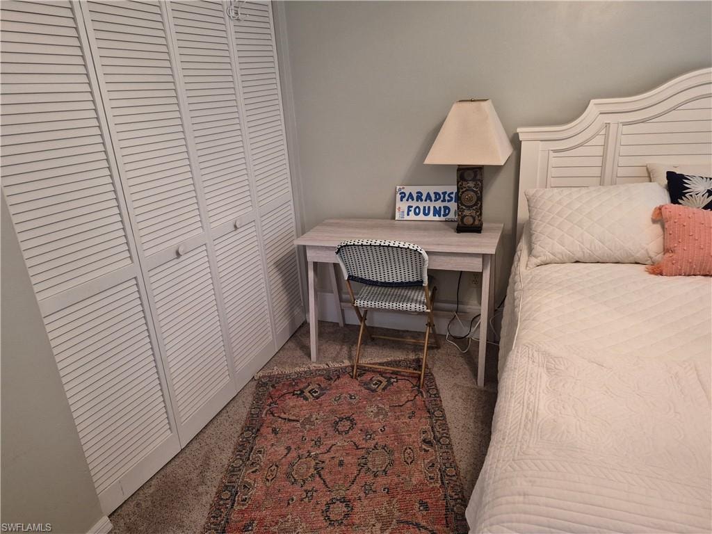 White louvered bi-fold doors provide closet access