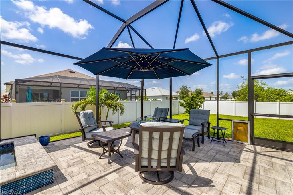 Screened patio featuring paver flooring