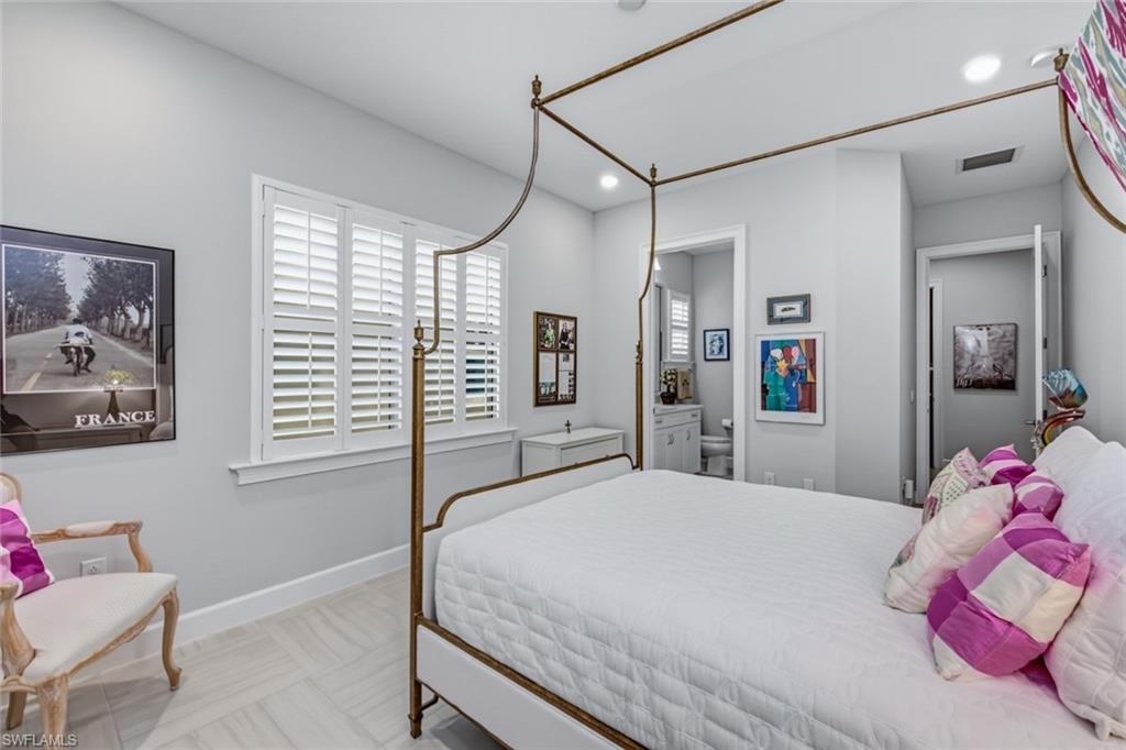 Bright and comfortable guest suite with plantation shutters and its own en-suite bath.
