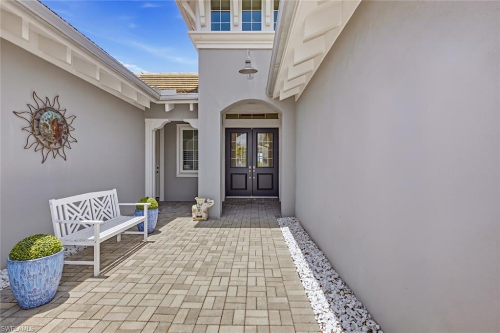 A private, covered entry courtyard creates a warm and welcoming arrival.