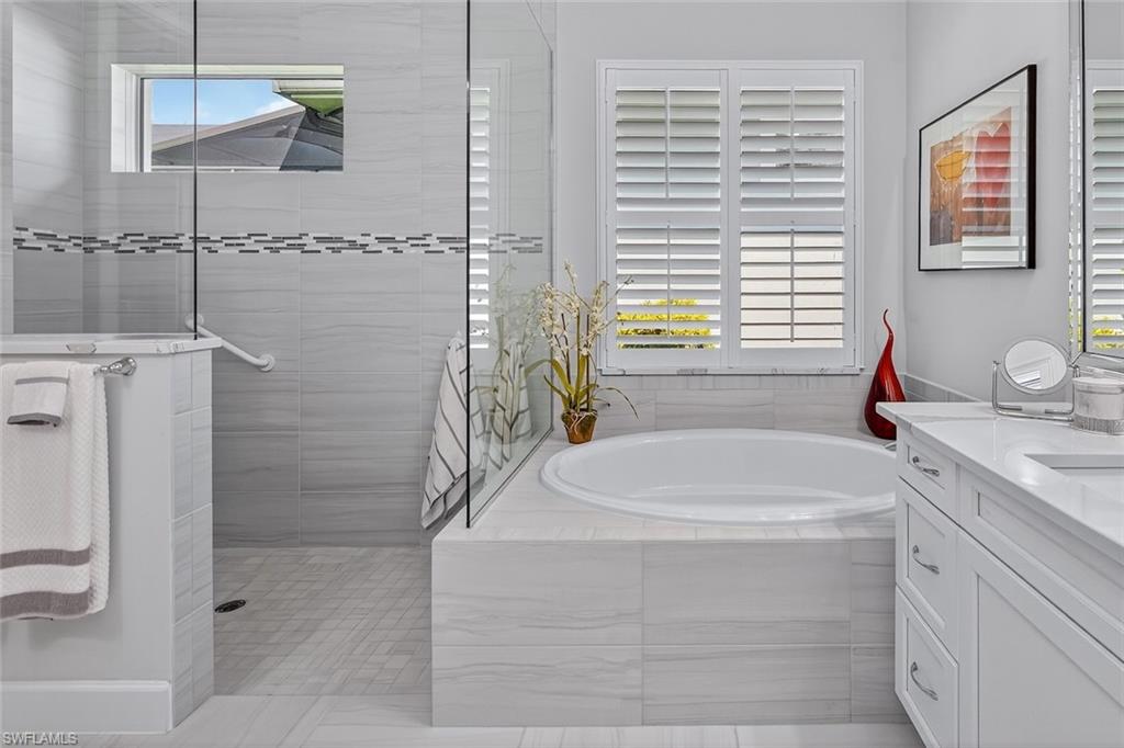 A spa-inspired bath with soaking tub, walk-in shower, and timeless finishes.