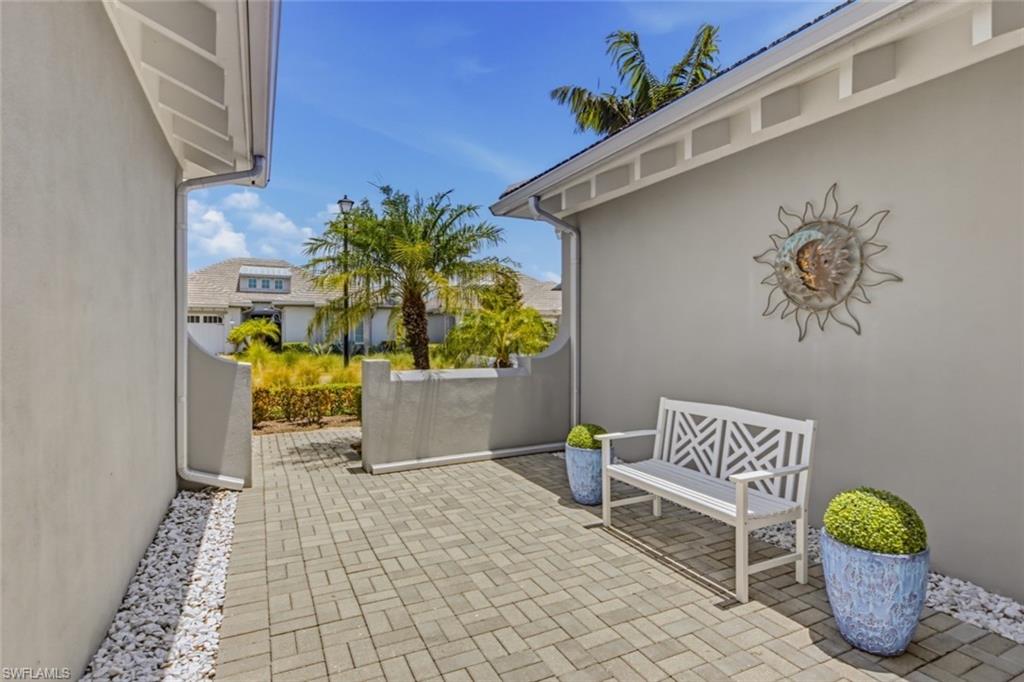 Enjoy the privacy and charm of the home's beautifully designed front courtyard.