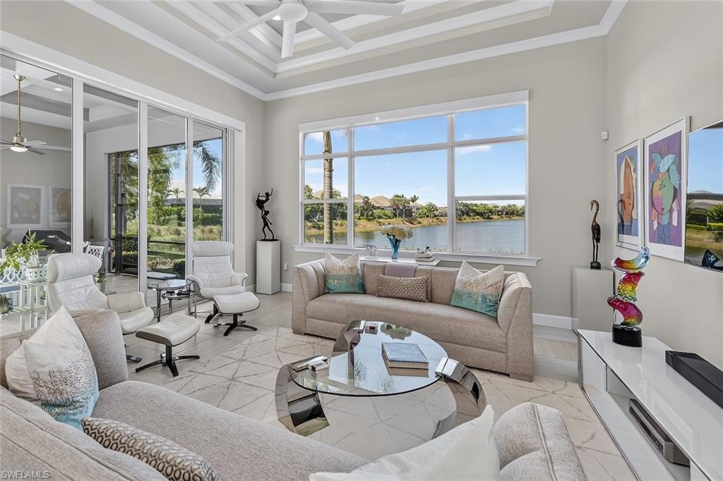 Walls of glass frame long lake views while blending indoor and outdoor living.