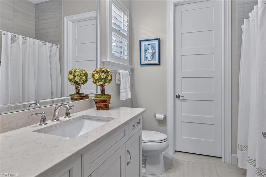 Thoughtfully appointed guest bath with elegant finishes.