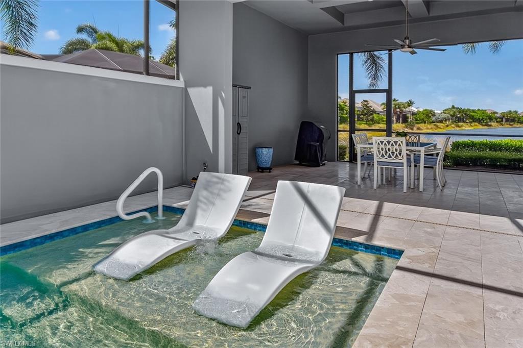 Relax on the sun shelf while enjoying complete courtyard privacy and long lake views beyond.