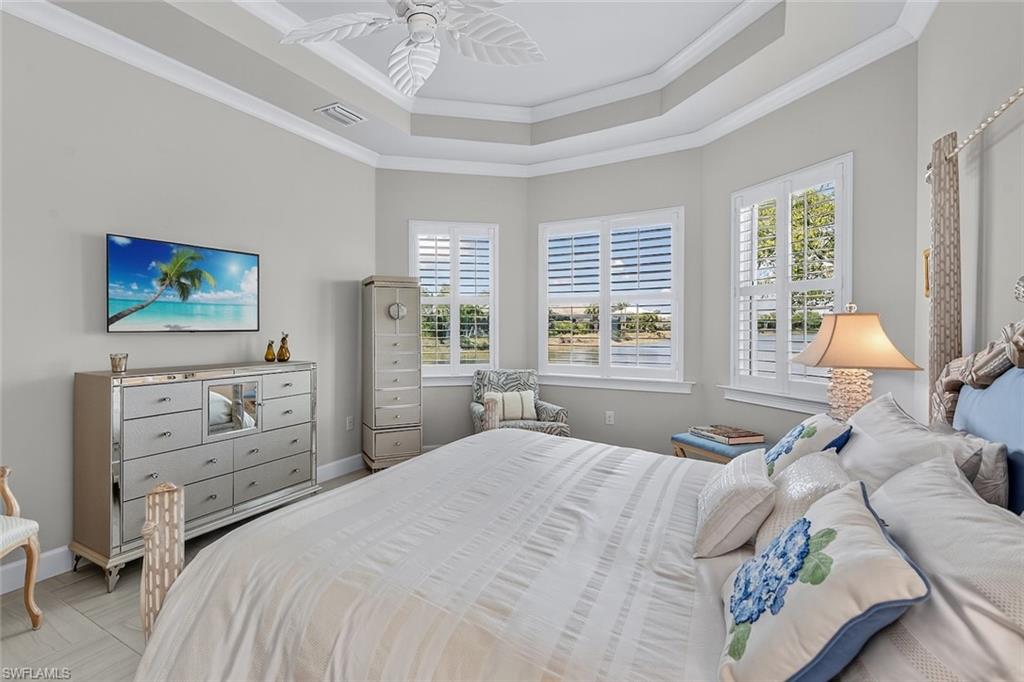Wake up to peaceful long lake views from the spacious primary suite retreat.