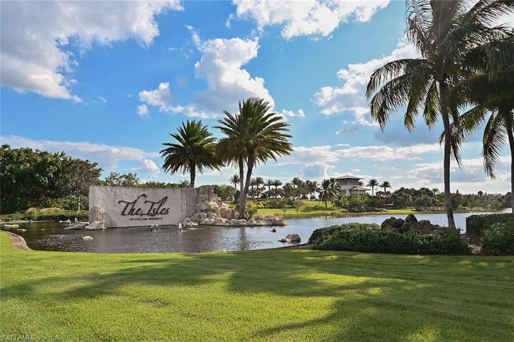 A grand, beautifully landscaped entrance welcomes you home to one of Naples' most sought-after gated communities.