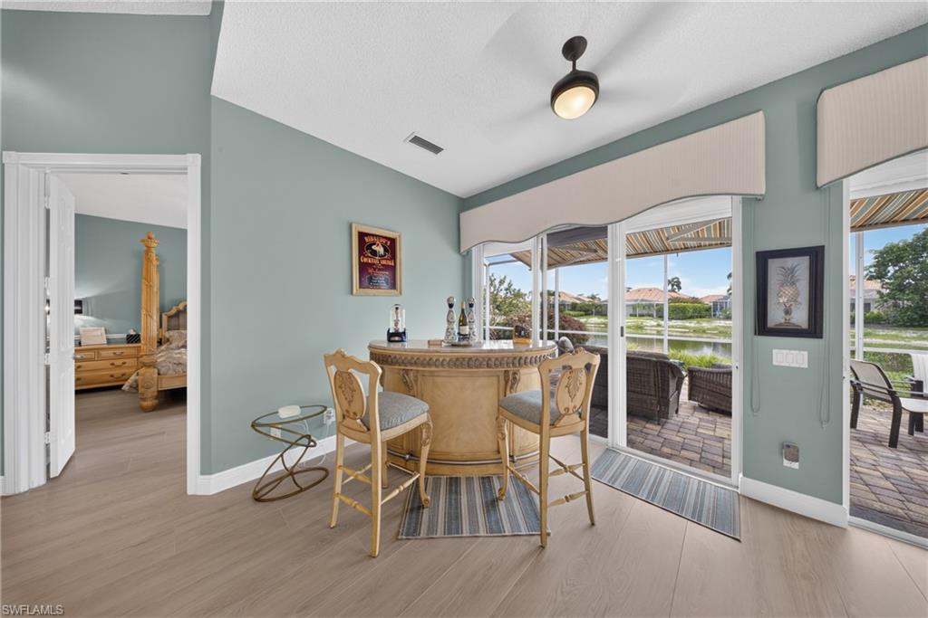 Light wood-finish flooring extending from the entryway