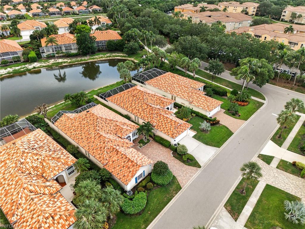 Aerial perspective showcasing a residential community with terracotta tile roofs