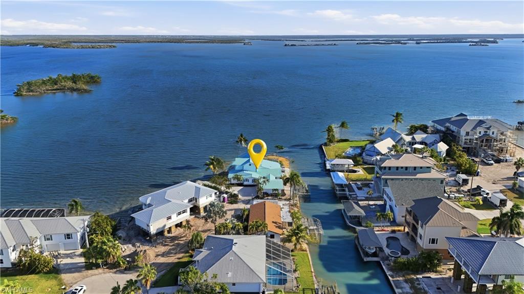 Aerial perspective of suburban area featuring a large body of water - Virtually Edited Image