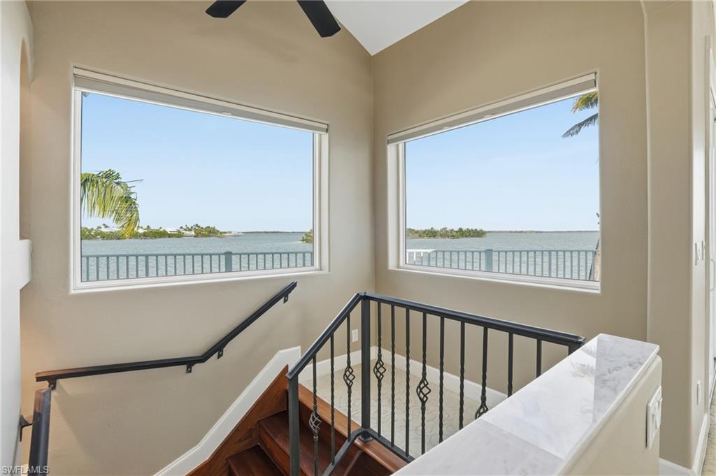 Stairs with a water view and healthy amount of natural light - Virtually Edited Image