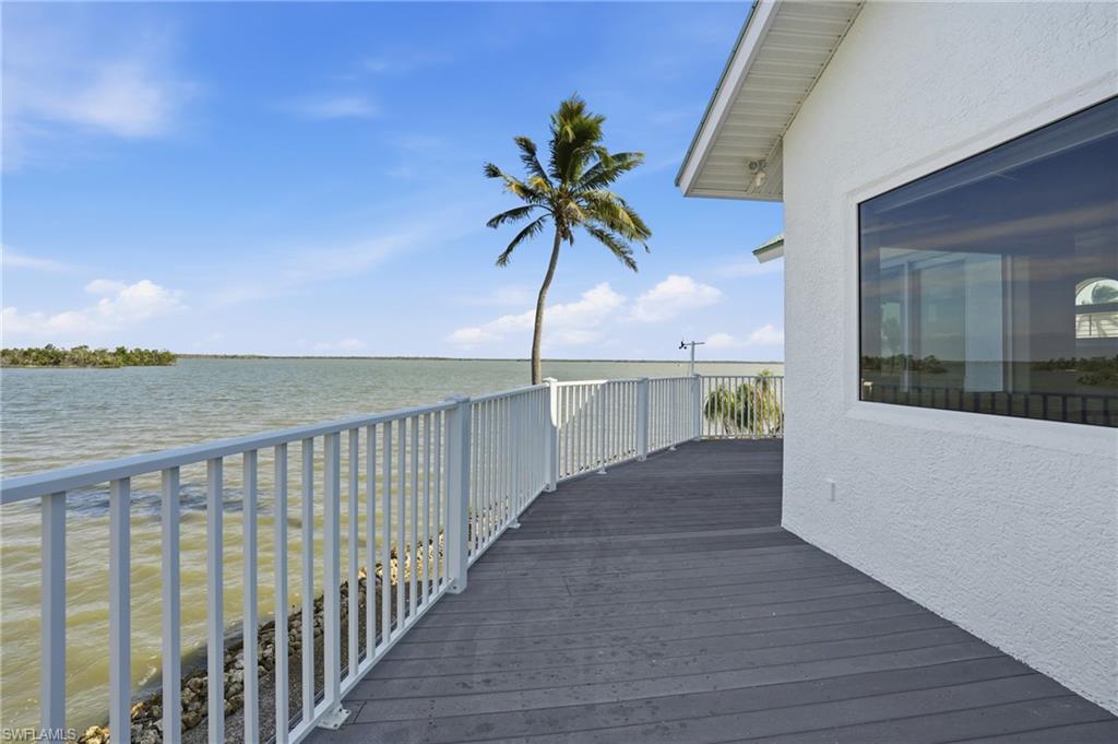 Wooden deck with a water view - Virtually Edited Image