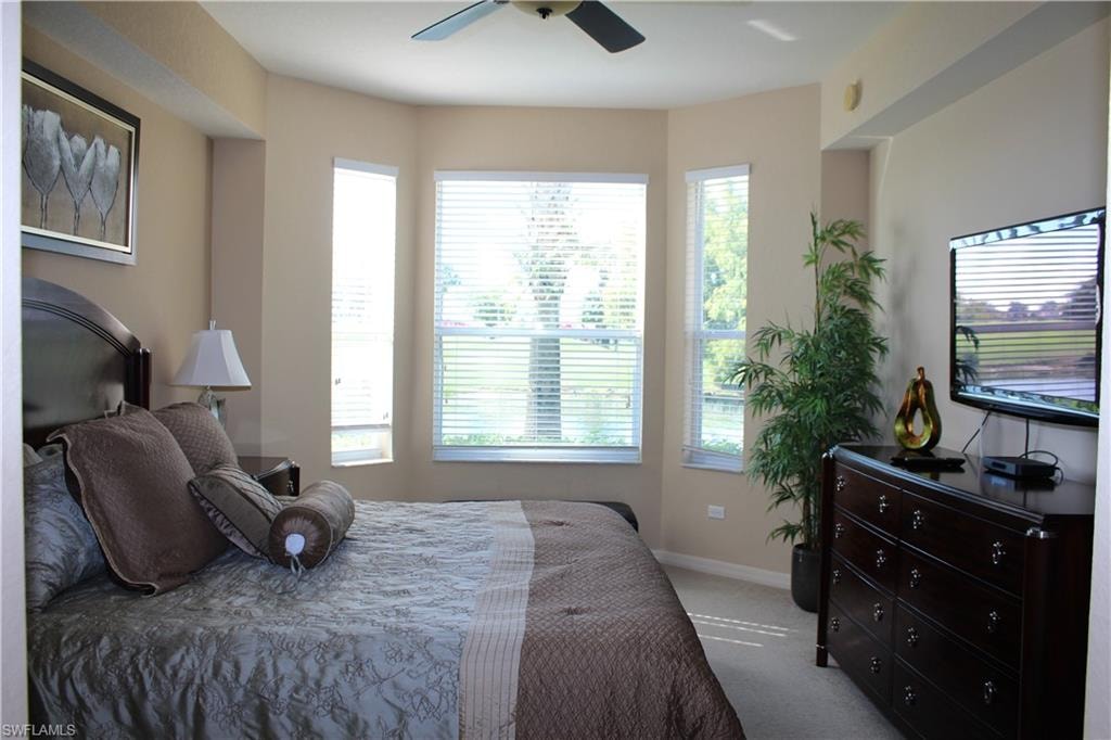 Master Bedroom with carpet flooring and ceiling fan