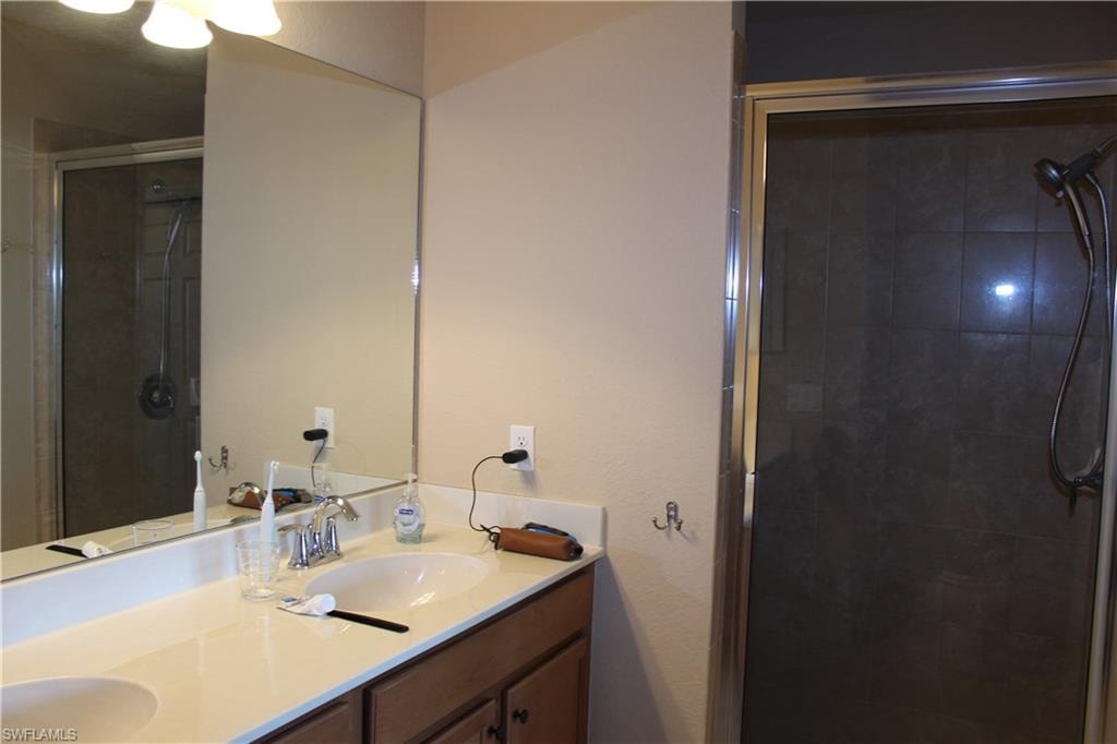 Master Full bath with a shower stall and double vanity