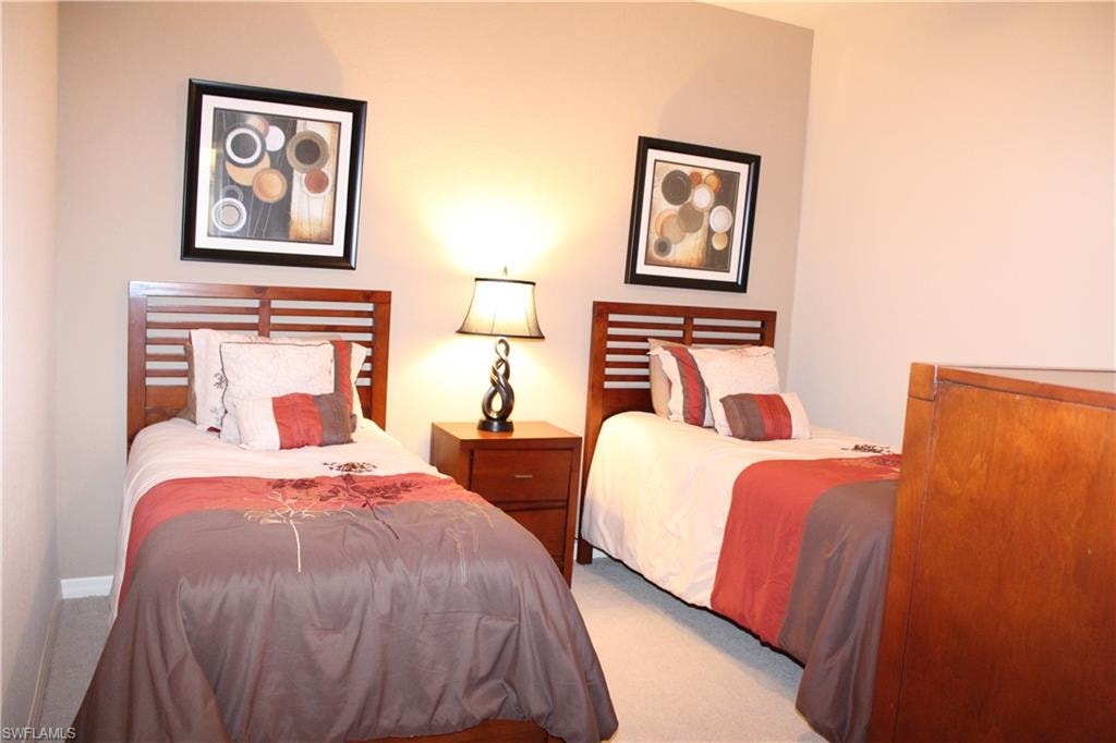 Guest Bedroom featuring carpet flooring