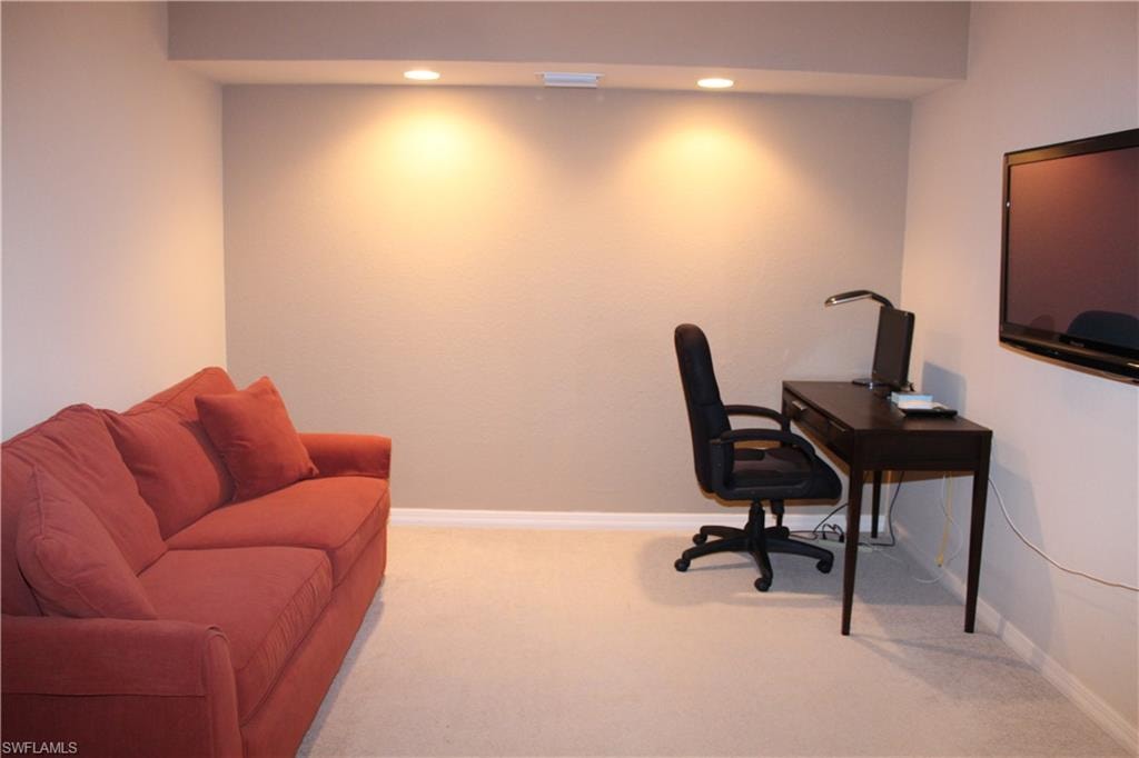 Den/Office area featuring carpet and recessed lighting