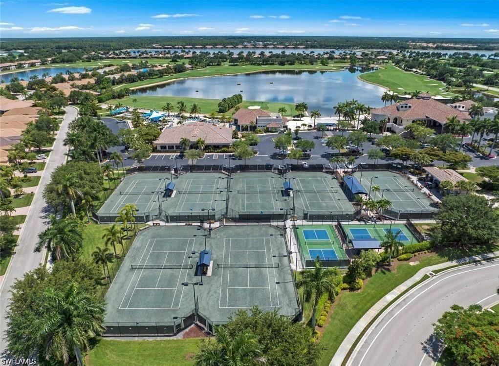 Aerial overview of property's location with a nearby body of water and nearby suburban area