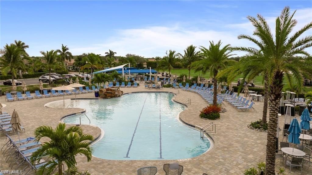 Community pool featuring a patio
