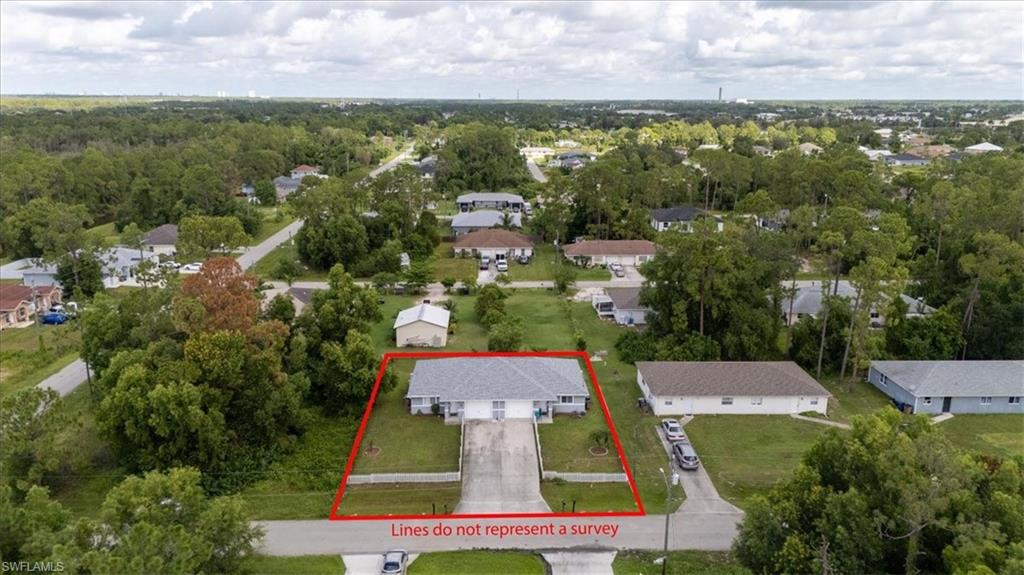Duplex property featuring two distinct units, each with a separate driveway and individual front entrances