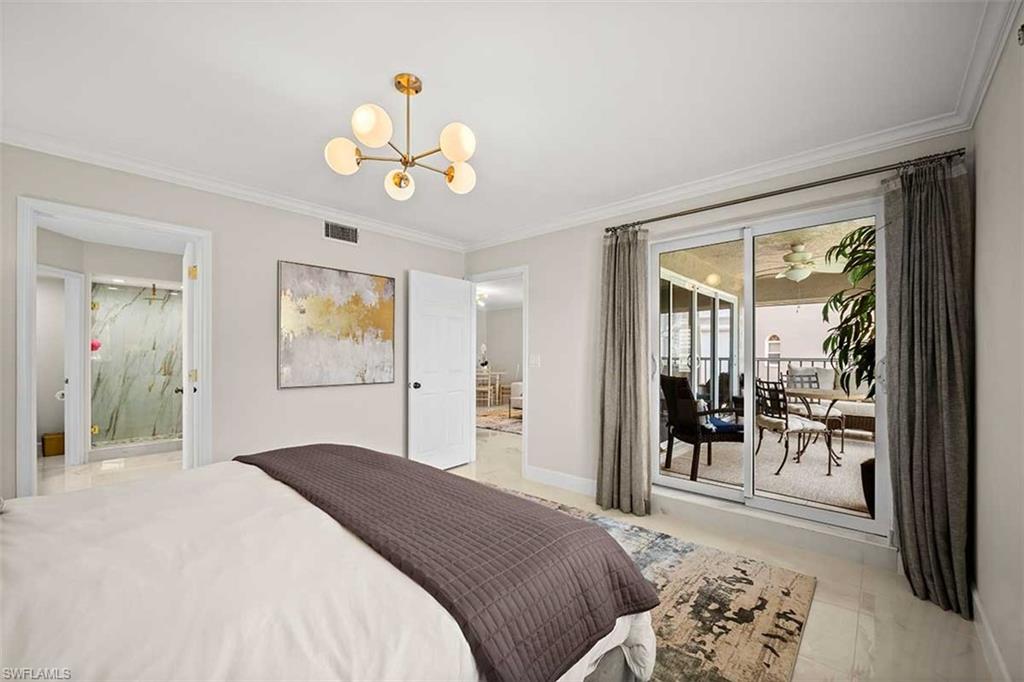 Light-toned room featuring a modern ceiling light fixture, crown molding, and light-colored tile flooring