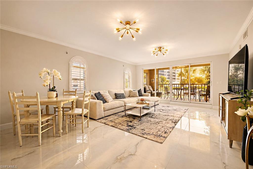 Spacious living area featuring polished tile flooring, contemporary ceiling light fixtures, and crown molding